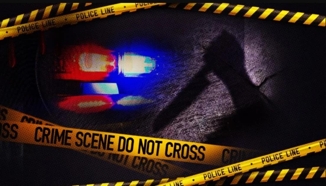 Police officers investigating a crime scene in Kiambu County after two labourers were killed