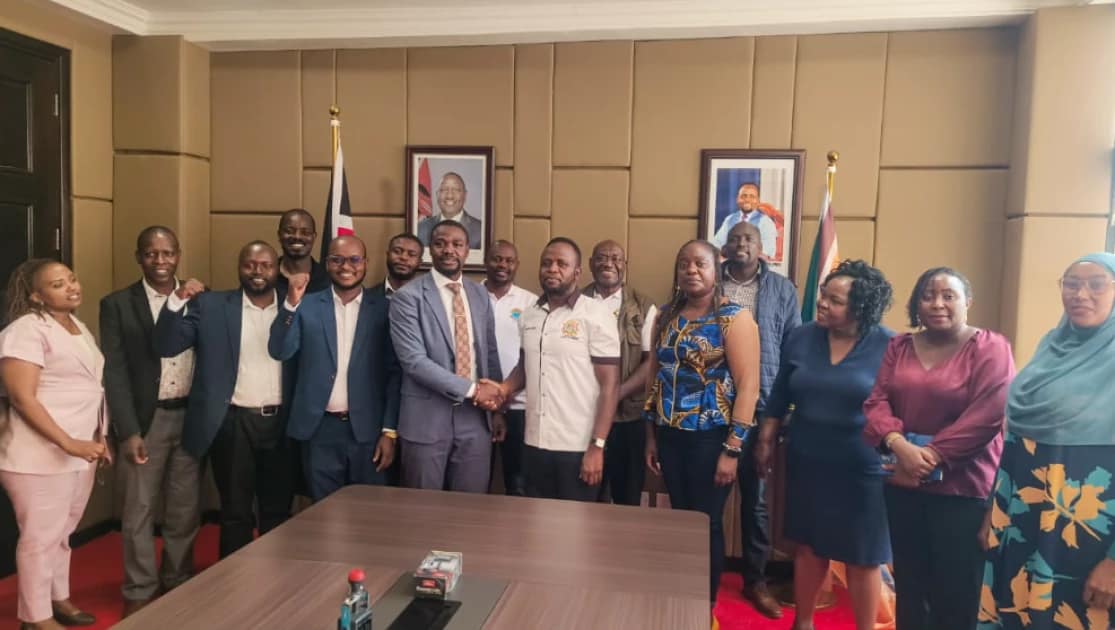 KMPDU Secretary General Dr. Davji Atellah and Trans Nzoia Governor George Natembeya, flanked by other officials, shake hands after signing of the deal. PHOTO | COURTESY