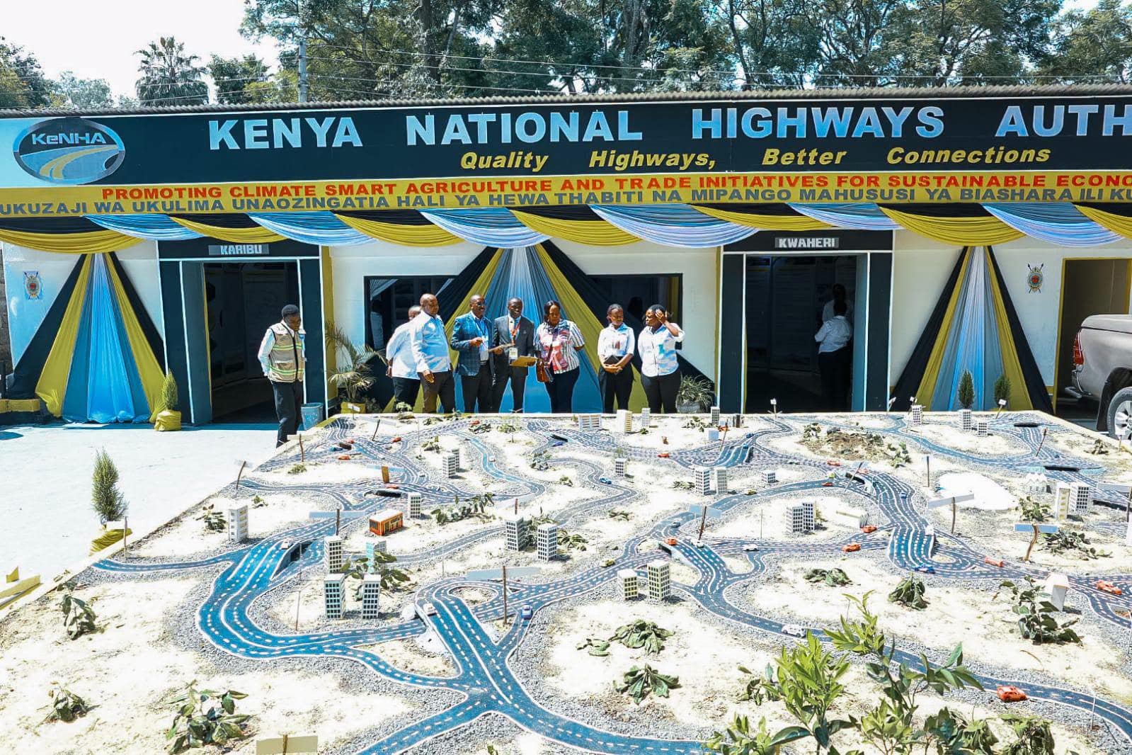 A wide view of the busy Ruiru-Githunguri-Uplands B116 road showing the demarcated public road reserves alongside traffic lanes
