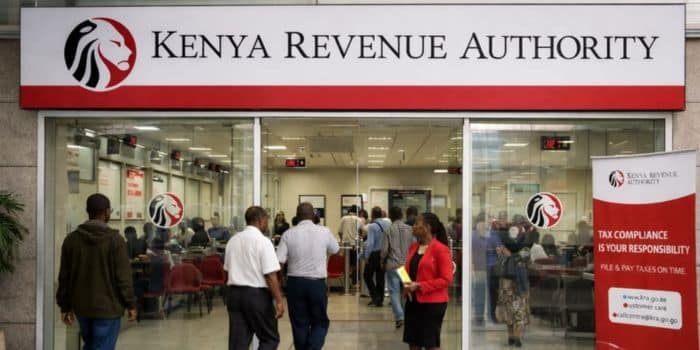 Person using mobile money as KRA announces crackdown on nil tax returns