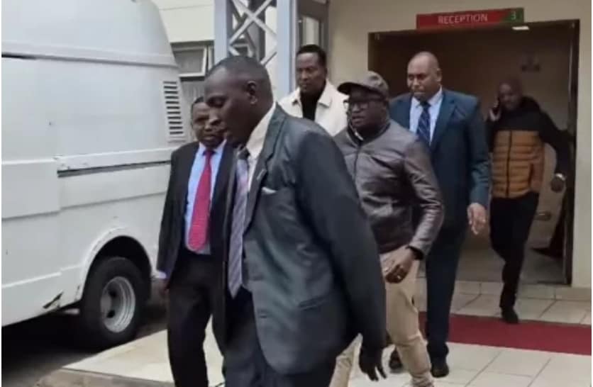 Detectives escort Mukurweini MP John Kaguchia to the DCI headquarters for questioning over alleged inciteful political remarks.