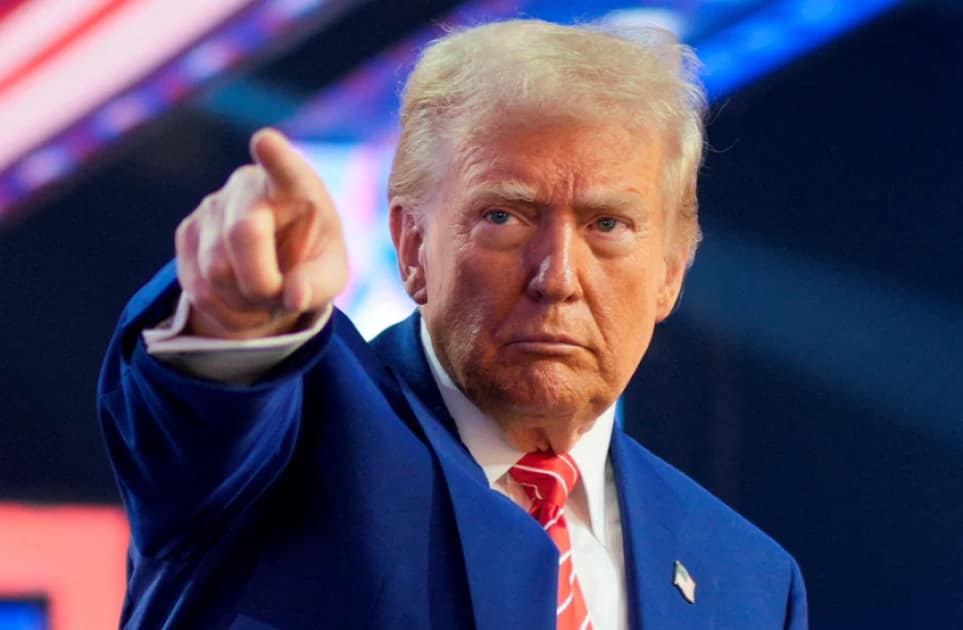 U.S. President-elect Donald Trump gestures at Turning Point USA's AmericaFest in Phoenix, Arizona, U.S., December 22, 2024. REUTERS/Cheney Orr/File Photo